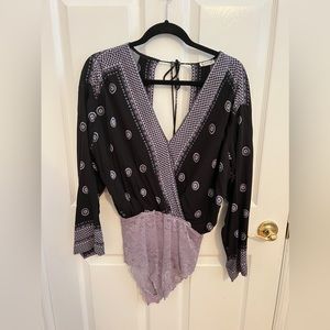 Free people body suit with an open back